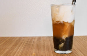jasmine boba milk tea in a tall glass